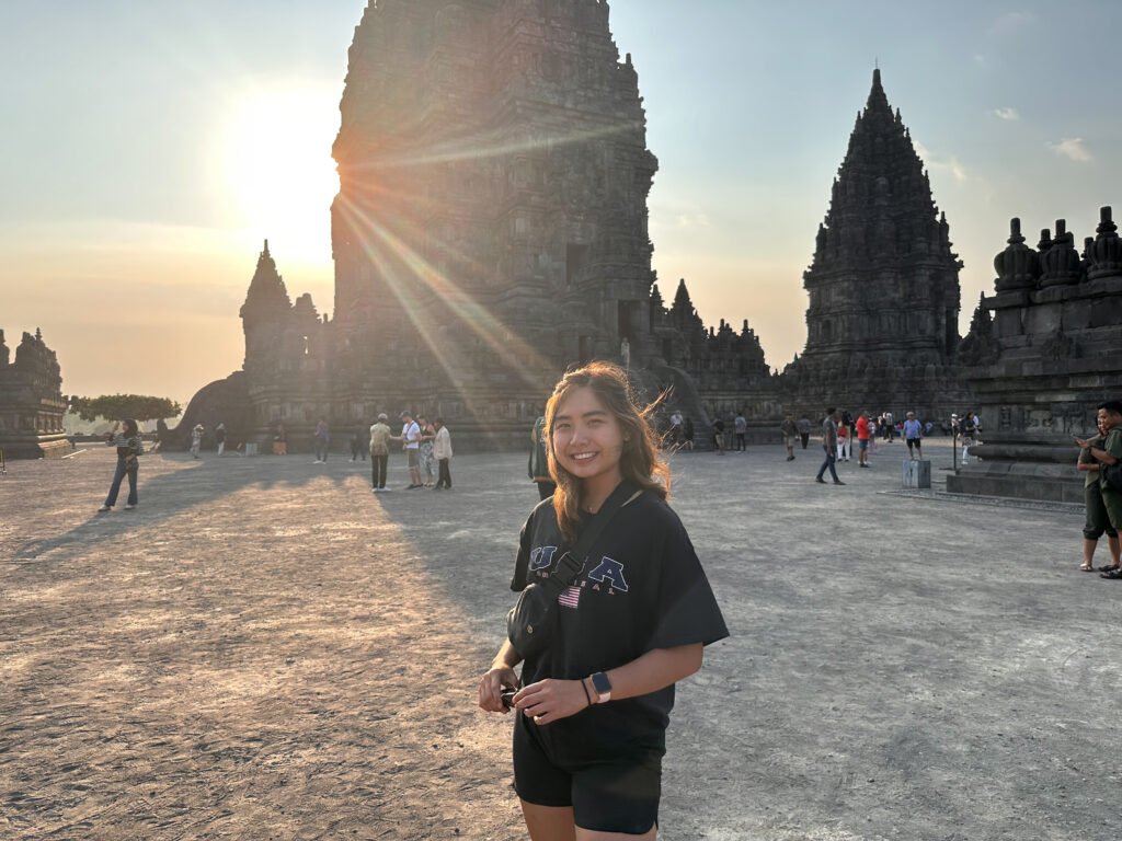 A girl in front of a sunset at Prambanan Temple in Yogyakarta Indonesia